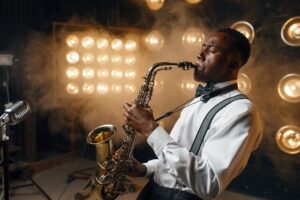 Black jazz performer plays the saxophone on stage