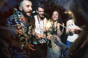 People Enjoying Sparkler in Festival Event